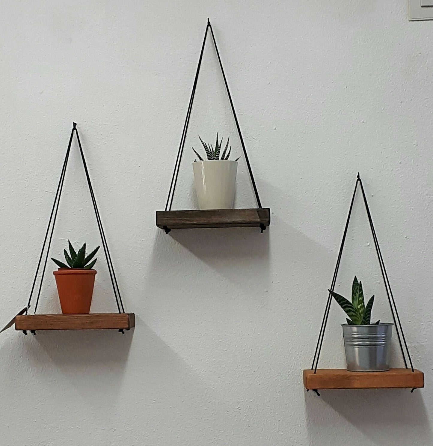 Rustic floating wall shelf with thin black rope