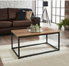 Coffee Table Contemporary coffee table with dark wood top and black legs.